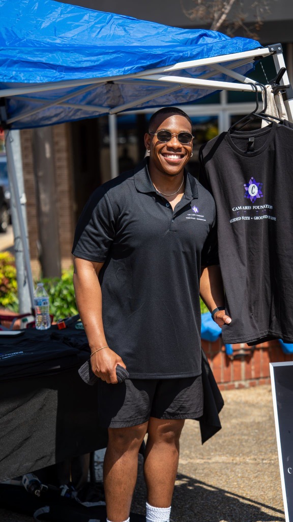 Founder A'Darius Cam Rucker at community event